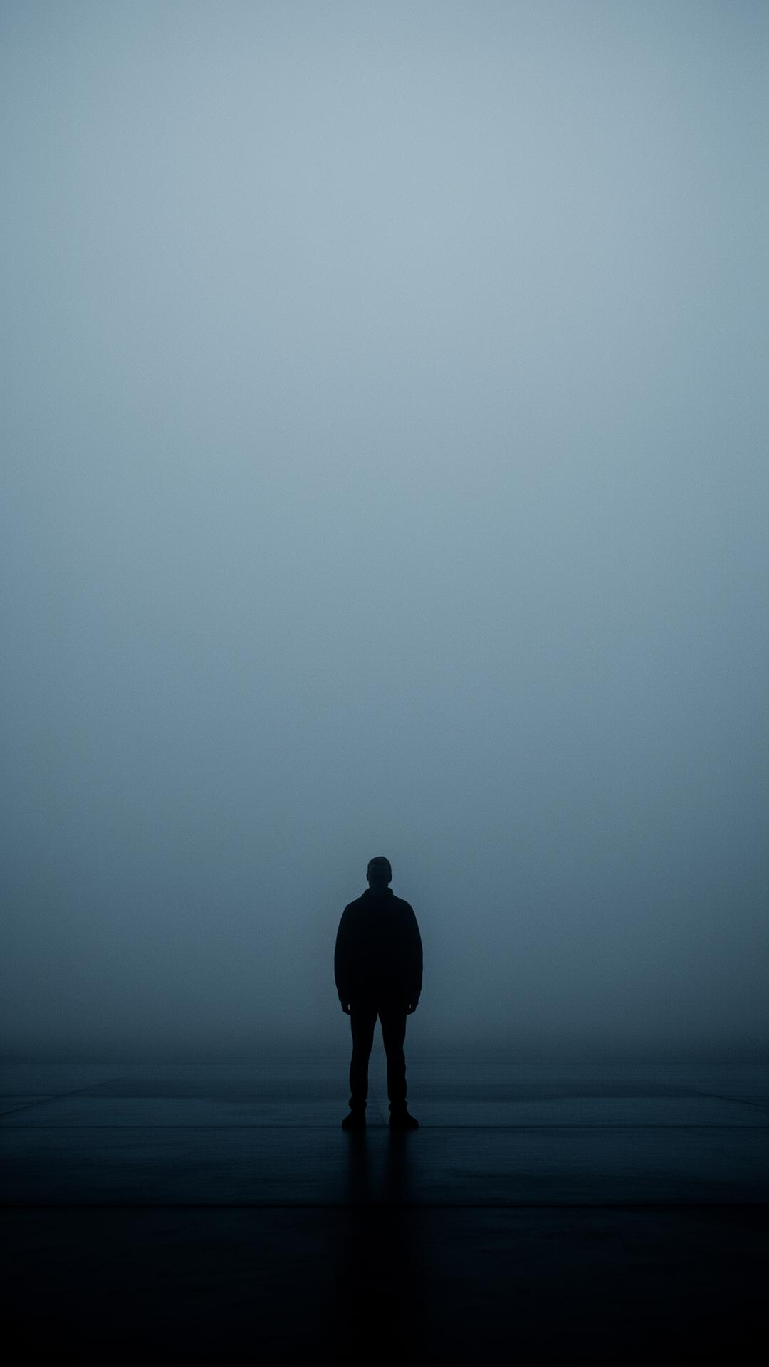A solitary figure in fog